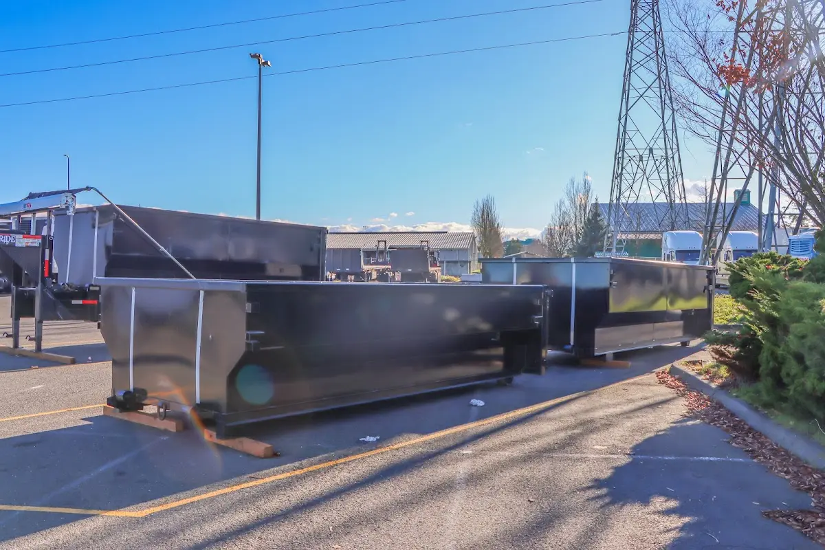 Roll-off dumpster ready for waste disposal at job site for 12 Yard Dumpster Rental in Covington